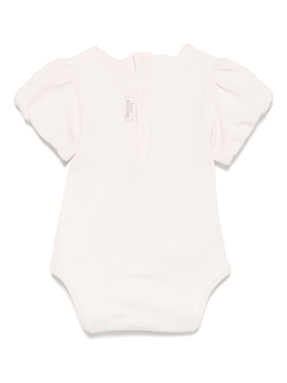 Body per neonata Donsje Nowie beige con motivo con ricamo - Rubino Kids