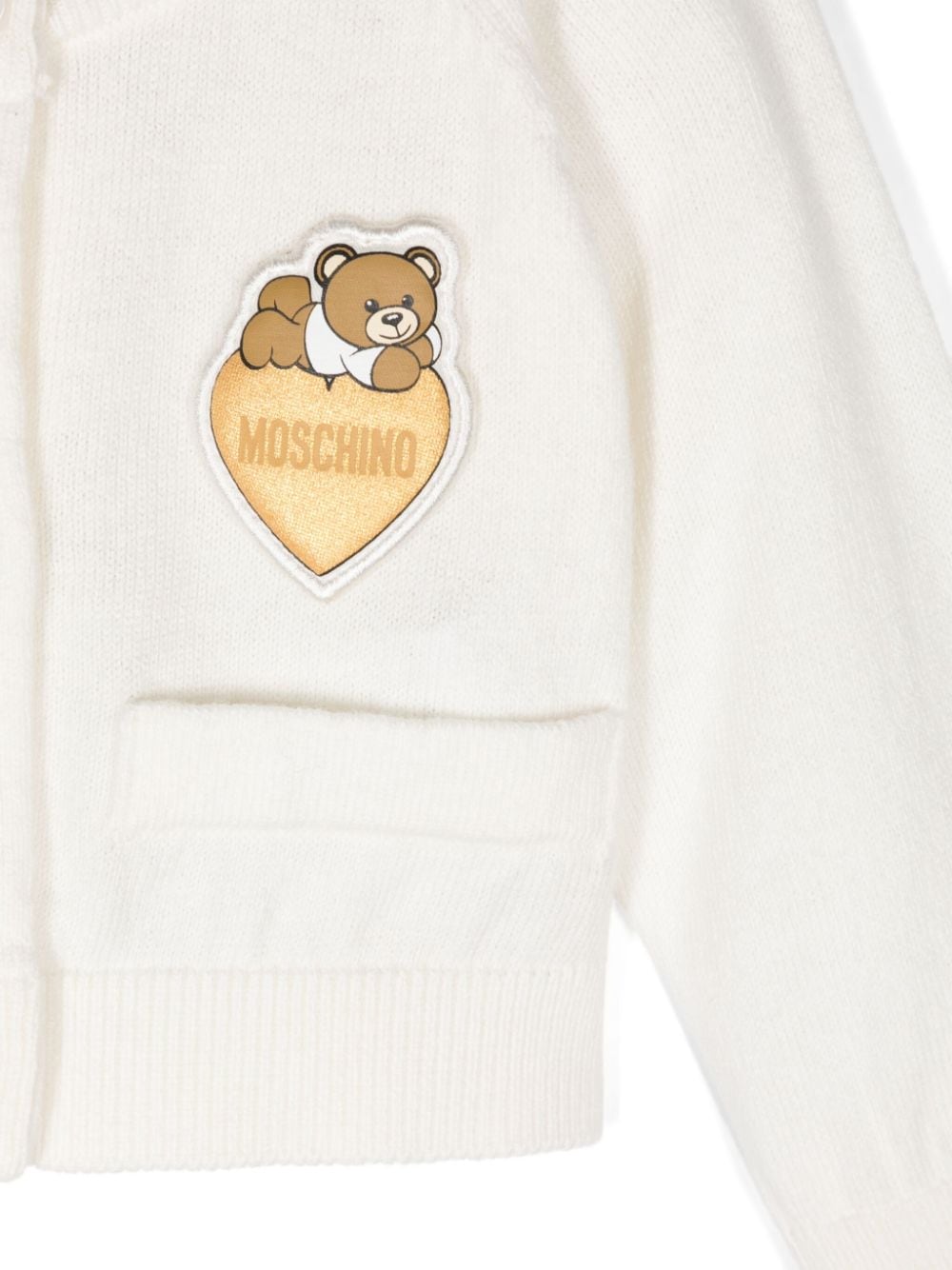 Cardigan per neonata Moschino Kids bianco con applicazione logo sul petto - Rubino Kids