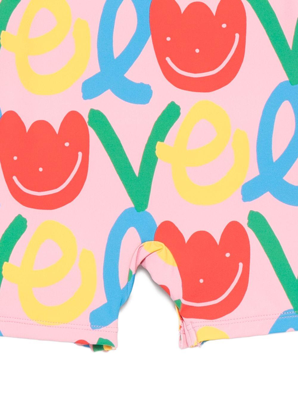 Costume intero per neonata Stella McCartney Kids rosa con stampa floreale all - over - Rubino Kids