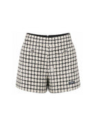 Shorts per bambina Balmain Kids bianco e neri con motivo a quadri BZ6B51 E0253 102AG BALMAIN KIDS 