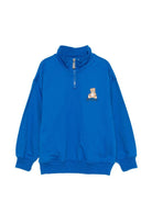 Felpa per bambino Moschino Kids blu con mezza zip HUF0A0LCA94 40157 MOSCHINO KIDS 