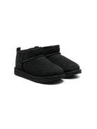 Stivali Ultra Mini per bambina UGG Kids neri con finitura idrorepellente<BR/> 1130750K BLK UGG 