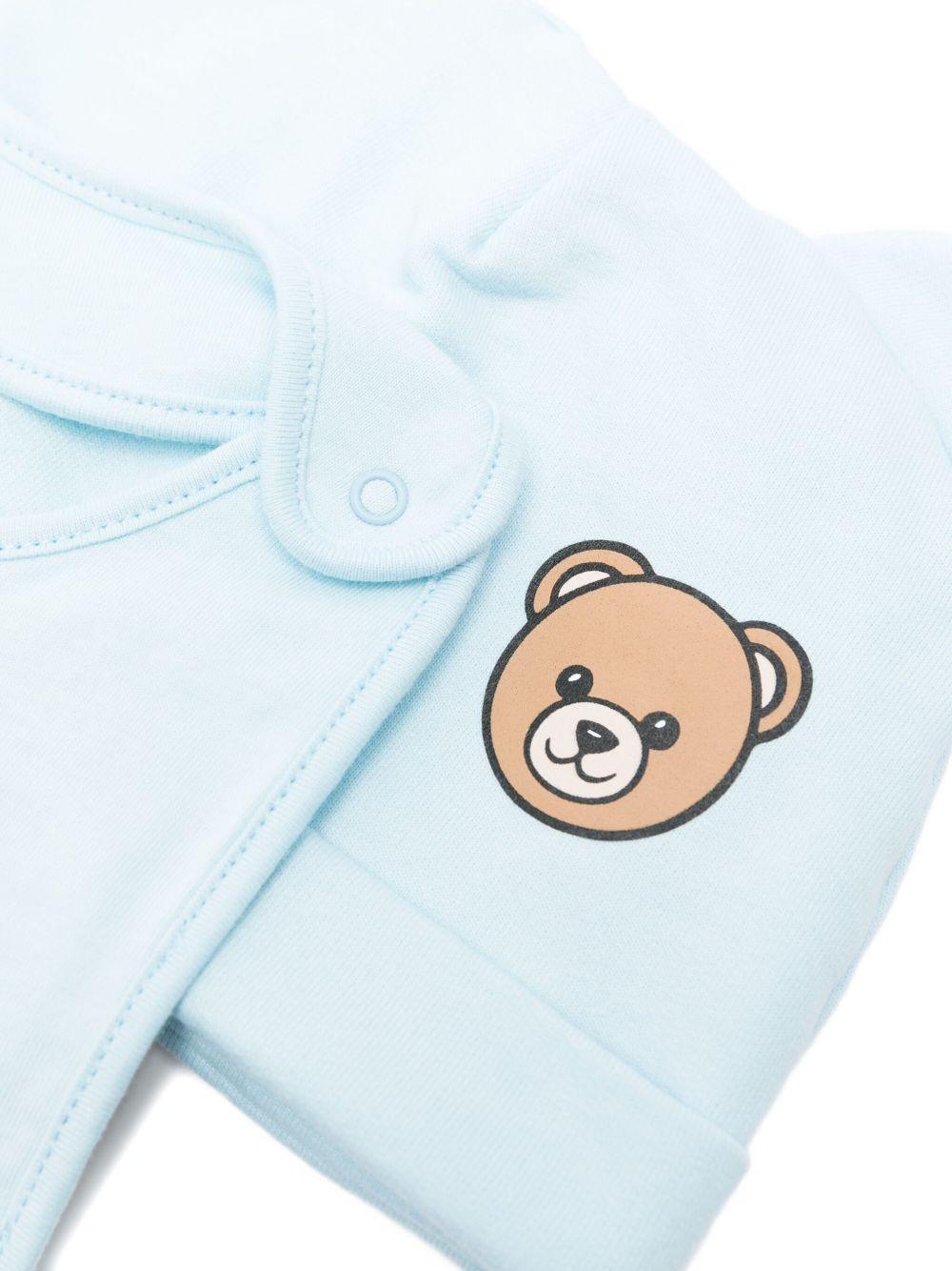 Set berretto e bavaglino per neonato Moschino Kids azzurro con motivo Teddy Bear MUY08KLCA40 40304 MOSCHINO KIDS 