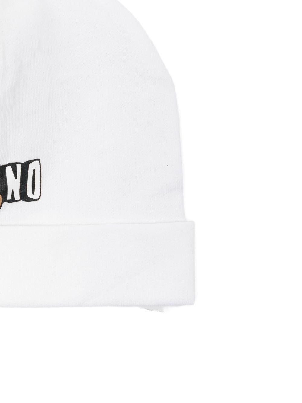 Set cappellino e bavaglino per neonati Moschino Kids bianco con logo sul davanti MUY095LCA19 10101 MOSCHINO KIDS 