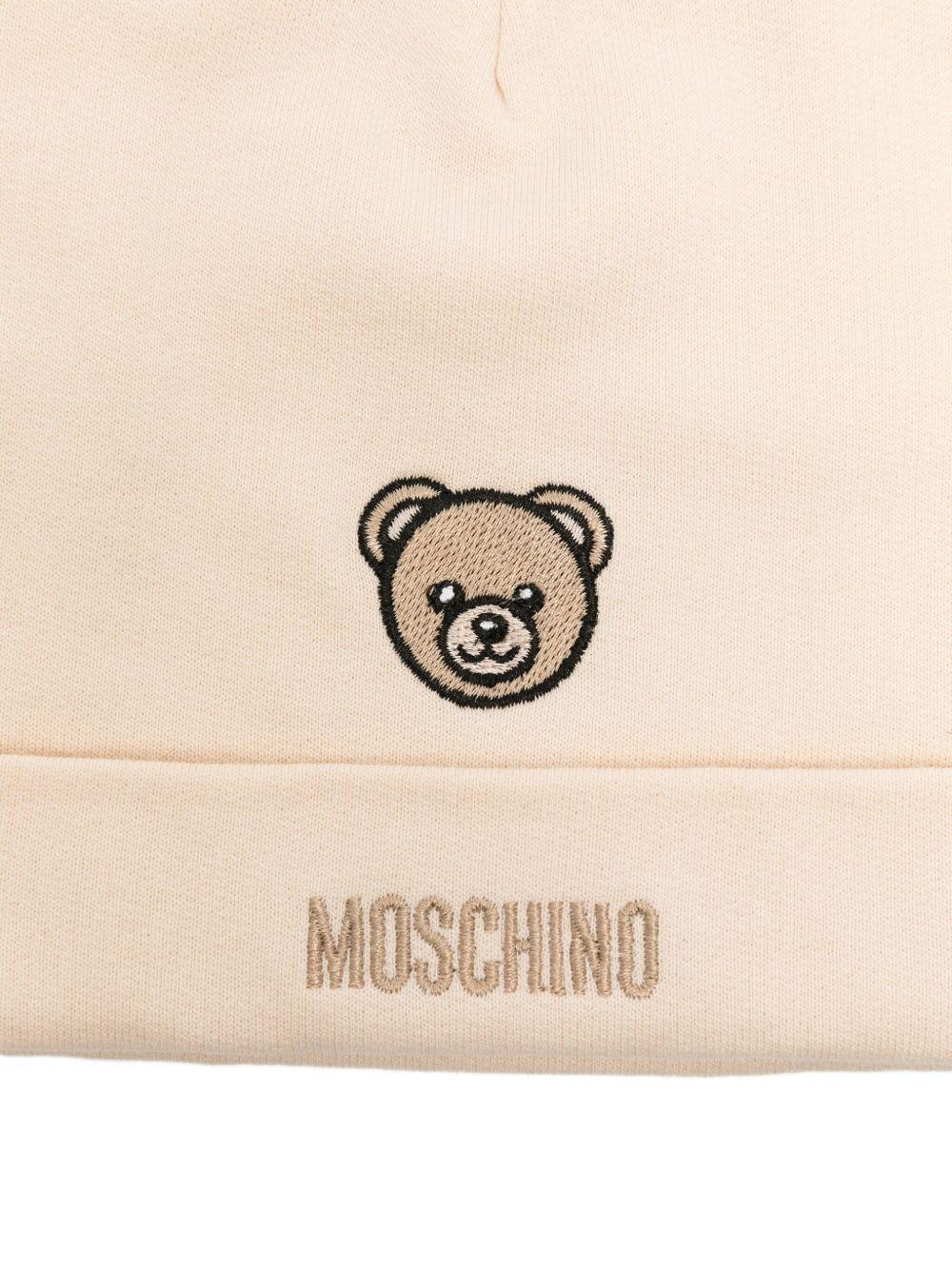 Set bavaglino con cappello per neonati Moschino Kids beige con ricamo di orsacchiotto MUY08OLCA60 20404 MOSCHINO KIDS 