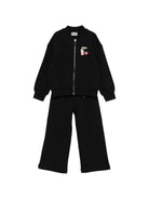 Tuta per bambina Moschino Kids nera con stampa grafica sul petto HDK038LCA52 60100 MOSCHINO KIDS 