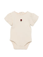 Tutina per neonata Donsje beige con dettaglio fiore sul davanti 3032705 00004 DONSJE KIDS 