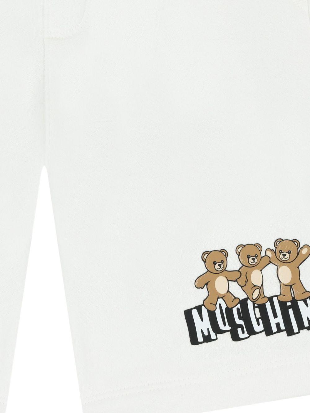 Shorts per bambino Moschino Kids bianchi con stampa tre Teddy Bear HUQ02MLCA89 10101 MOSCHINO KIDS 