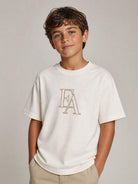 T-shirt per bambino Emporio Armani Kids bianca con lettere logo EB001367 AF26009 U1009 EMPORIO ARMANI KIDS 
