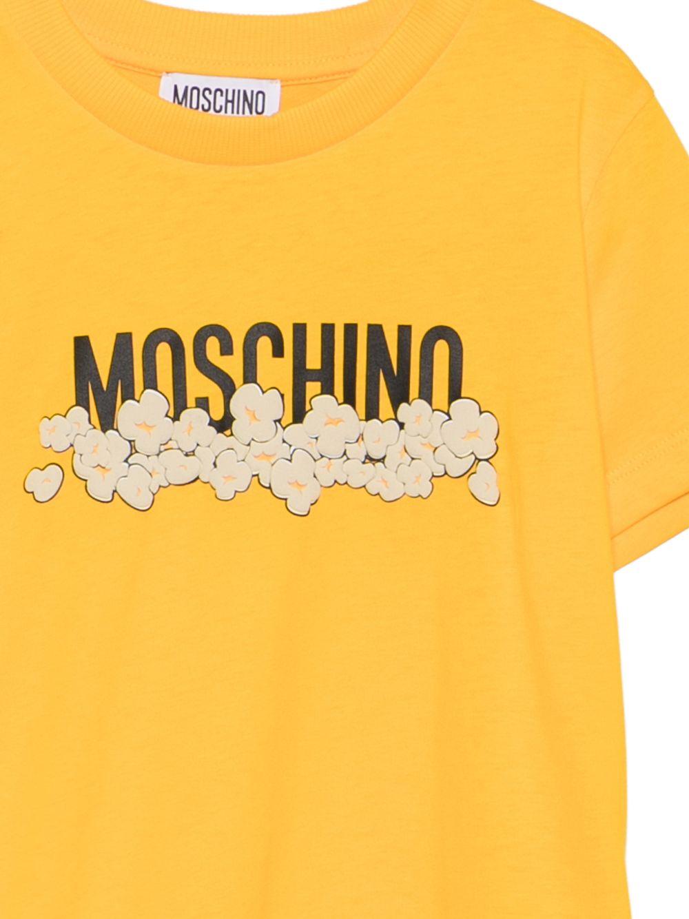 T-shirt per bambini Moschino Kids gialla con stampa grafica con logo H6M058LAA20 51140 MOSCHINO KIDS 