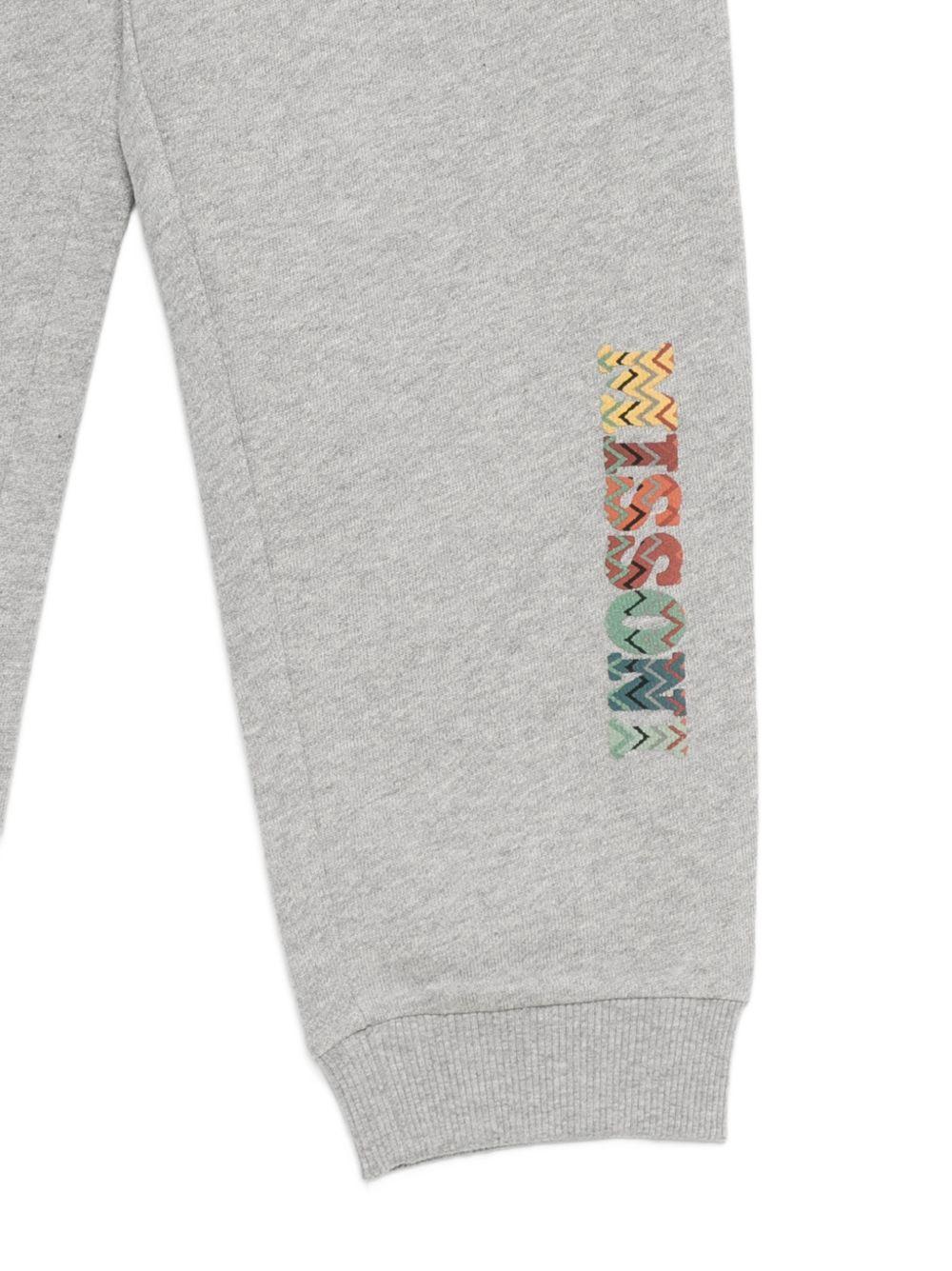 Pantaloni per bambino Missoni Kids grigi con dettaglio logo sulla gamba MZ6H00 Z3188 806 MISSONI KIDS 