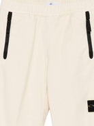 Pantaloni per bambino Stone Island Junior bianchi con applicazione con logo K2S163100006S0202 V0093 STONE ISLAND JUNIOR 