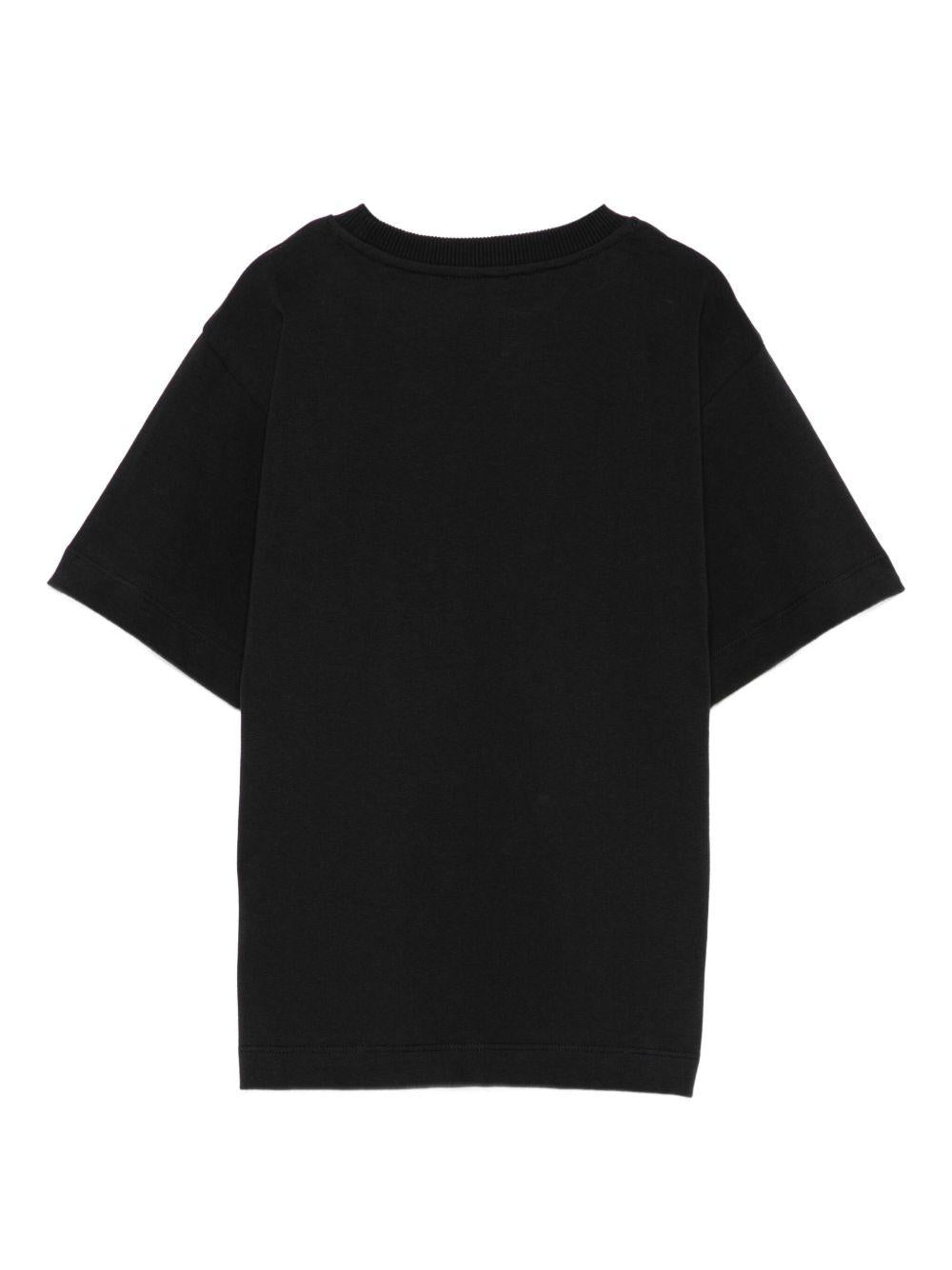 T-shirt per bambino Moschino Kids nero con stampa smiley HSM05GLAA01 60100 MOSCHINO KIDS 