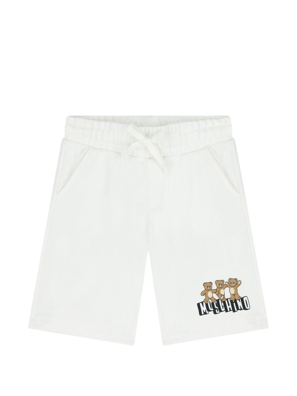 Shorts per bambino Moschino Kids bianchi con stampa tre Teddy Bear HUQ02MLCA89 10101 MOSCHINO KIDS 