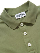 Polo da bambino Moschino Kids verde con stampa orsacchiotto HSM03YLFA09 30037 MOSCHINO KIDS 