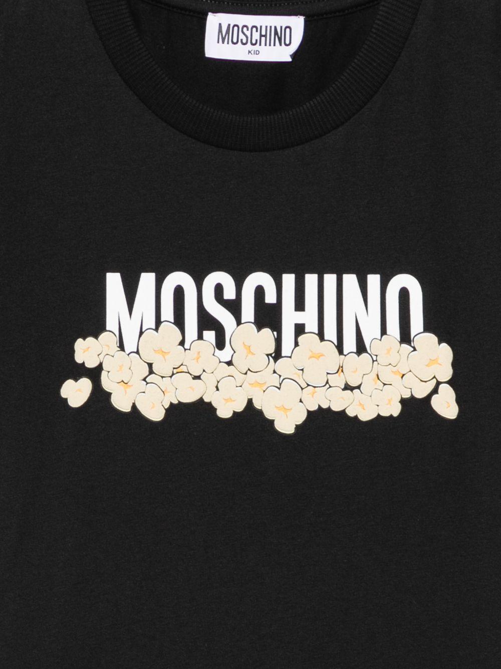 T-shirt per bambini Moschino Kids nera con stampa grafica con logo H6M058LAA20 60100 MOSCHINO KIDS 