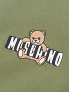 Polo da bambino Moschino Kids verde con stampa orsacchiotto HSM03YLFA09 30037 MOSCHINO KIDS 