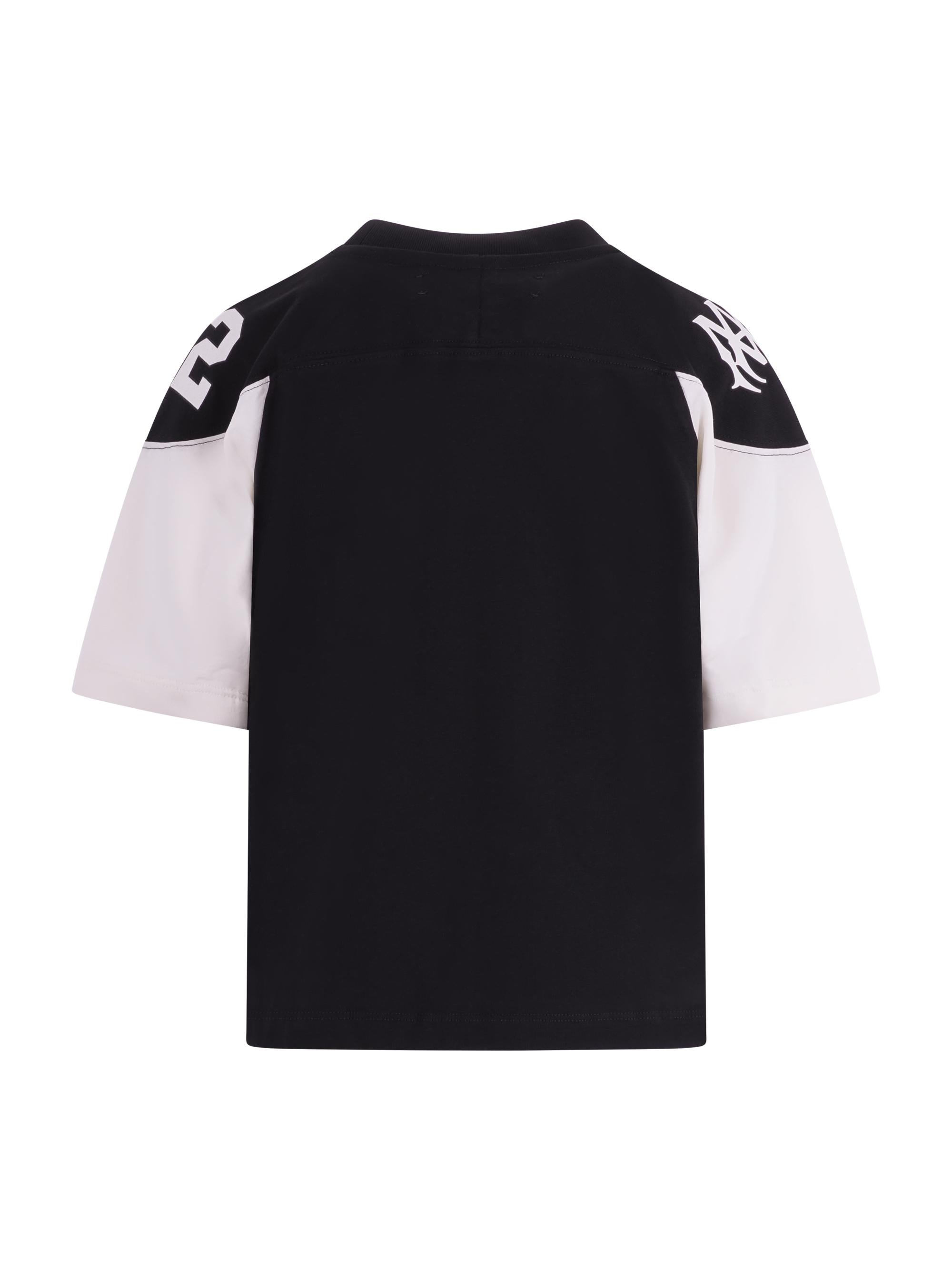 T-shirt per bambino Amiri Kids nero con logo sul davanti ACTOJR1002 001 AMIRI KIDS 