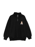 Felpa per bambino Moschino Kids nera con mezza zip HUF0A0LCA94 60100 MOSCHINO KIDS 