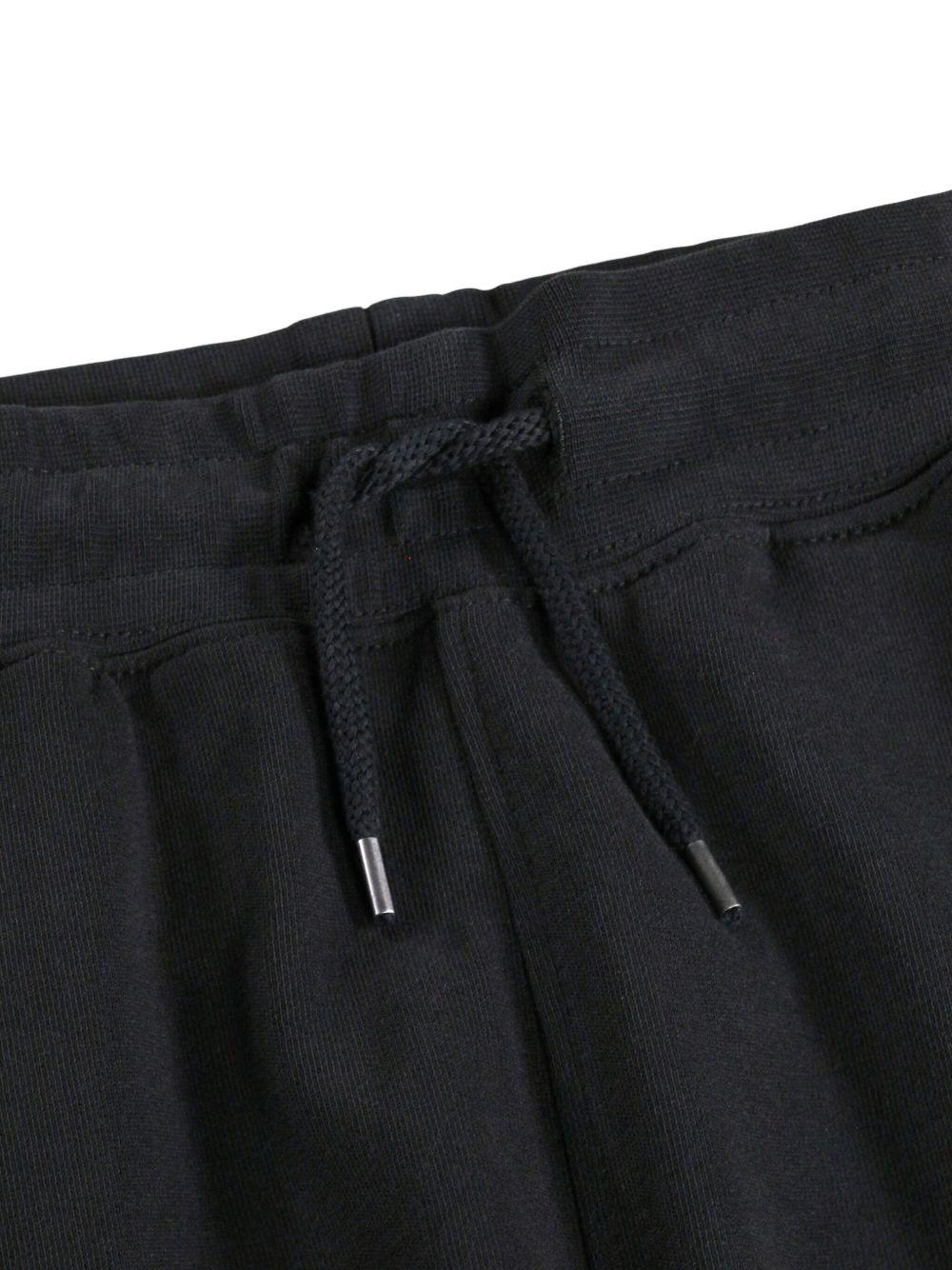 Pantaloni Alvar per bambino Molo neri con quadrante con smiley 6S26I201 0099 MOLO KIDS 