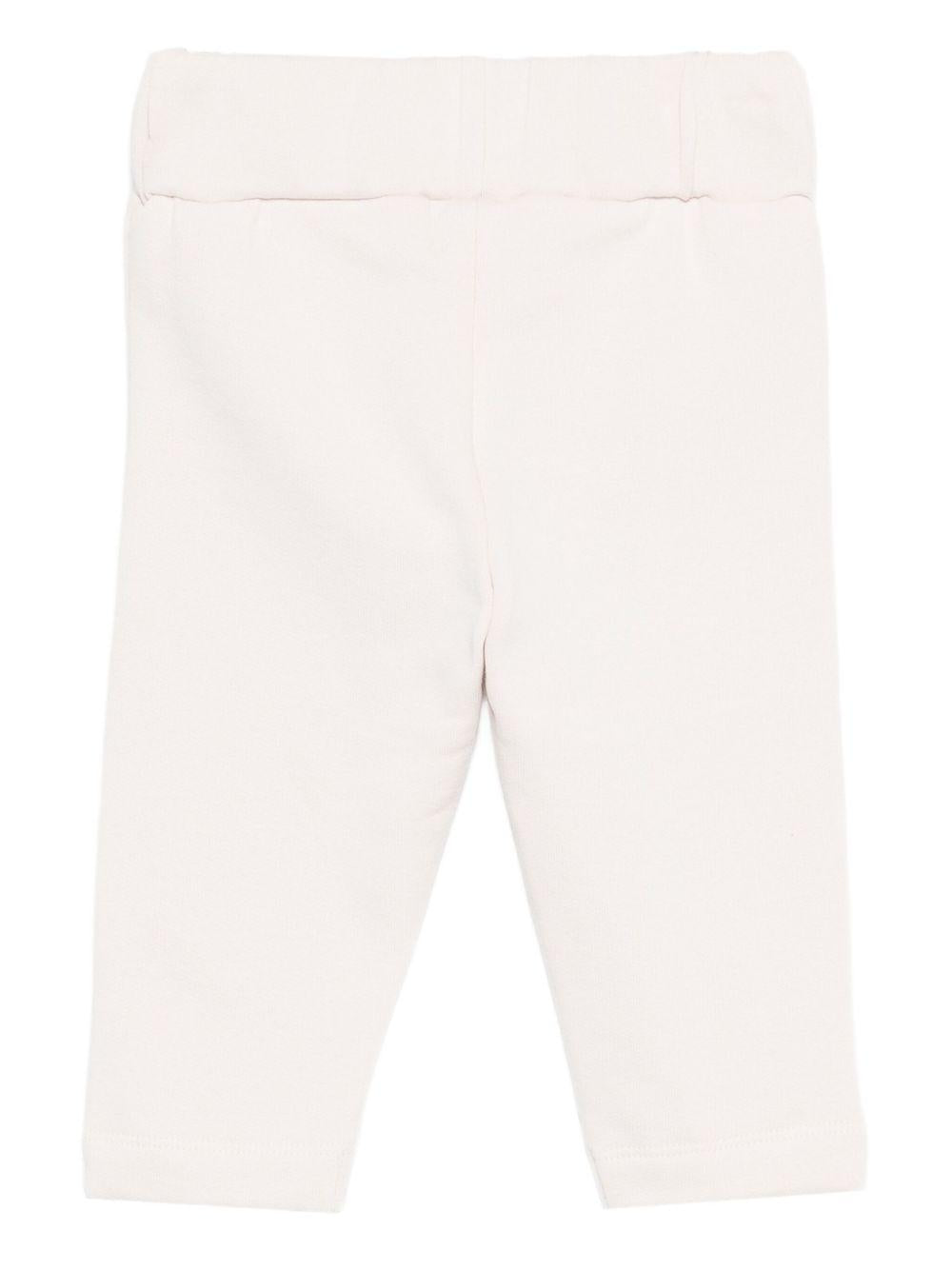 Pantaloni per neonata Donsje bianchi con motivo unicorno 3040705 00001 DONSJE 