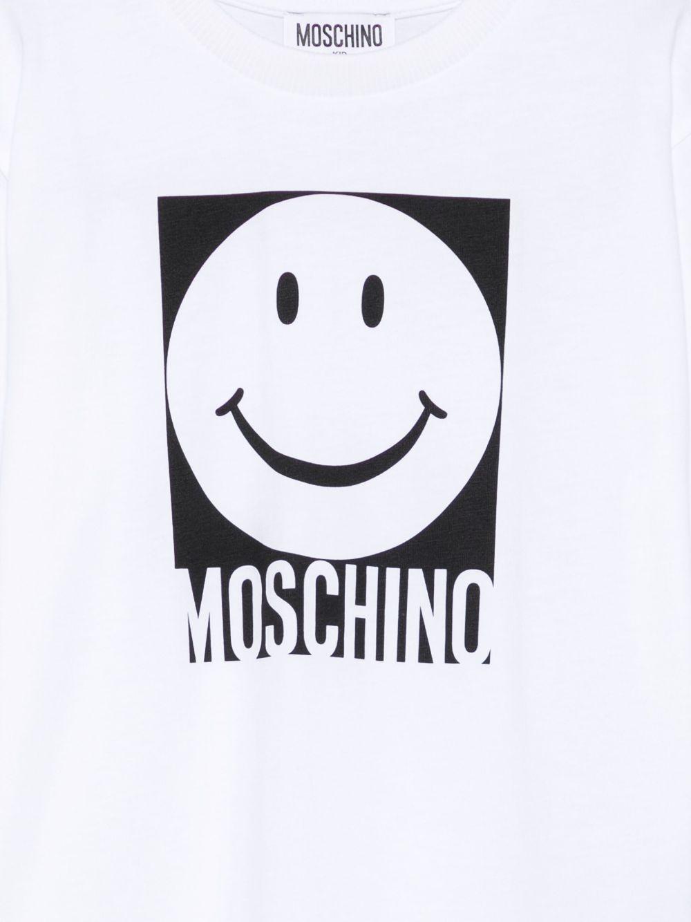 T-shirt per bambino Moschino Kids bianco con motivo smiley HSM05GLAA01 10101 MOSCHINO KIDS 
