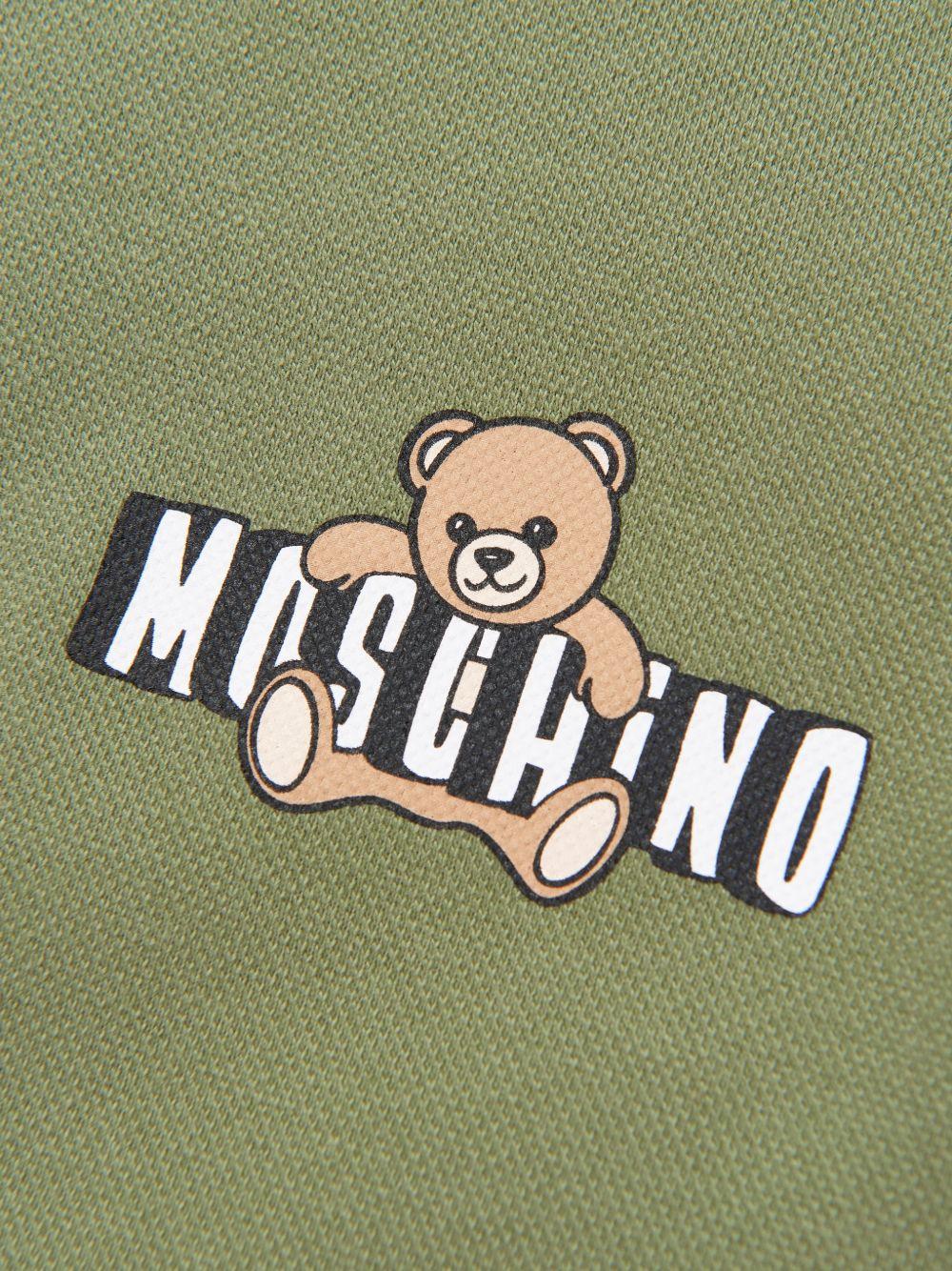 Polo da bambino Moschino Kids verde con stampa orsacchiotto HSM03YLFA09 30037 MOSCHINO KIDS 