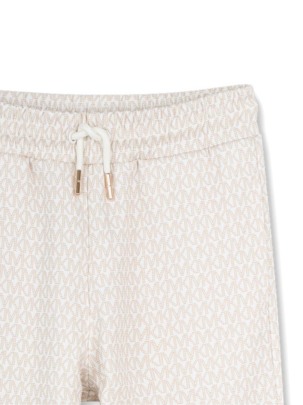 Pantaloni per bambino Michael Kors Kids bianchi con motivo all-over R30571 190 MICHAEL KORS KIDS 