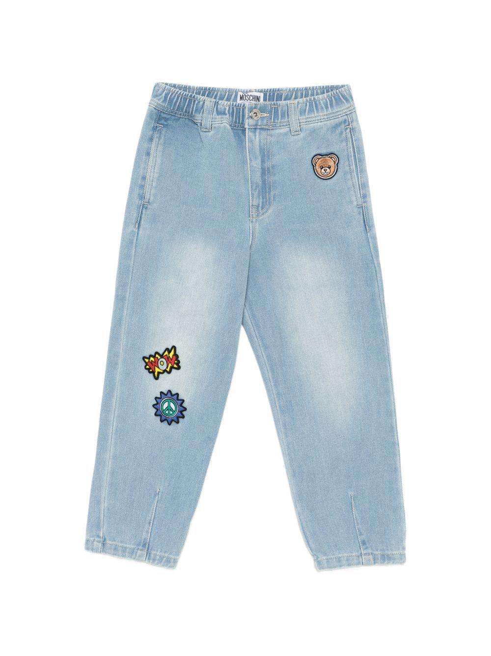 Jeans per bambino Moschino Kids azzurri con decorazioni in rilievo HUP08XL0E37 41100 MOSCHINO KIDS 