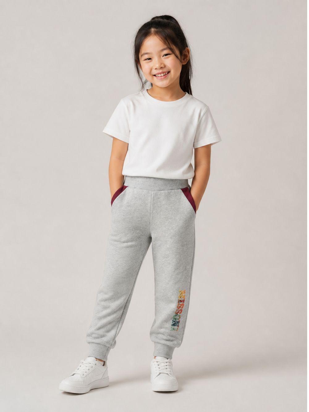 Pantaloni per bambino Missoni Kids grigi con dettaglio logo sulla gamba MZ6H00 Z3188 806 MISSONI KIDS 