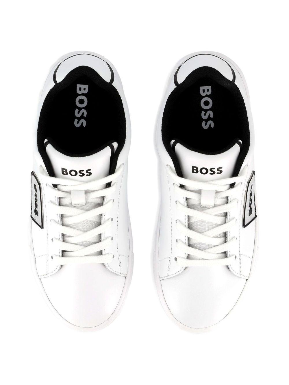Sneakers per bambino BOSS Kids bianche con dettaglio con placca con logo J52554 10P BOSS KIDS 