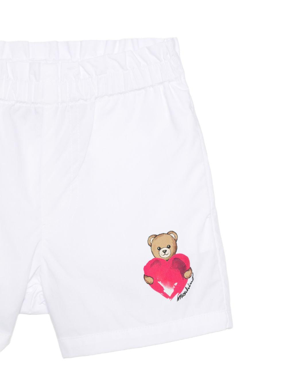 Shorts per neonata Moschino Kids bianchi con stampa Teddy Bear sul davanti MDQ00FLLA10 10101 MOSCHINO KIDS 