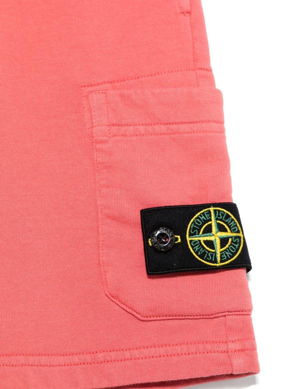 Shorts con applicazione Compass per bambino Stone Island Junior rosa con tasca laterale K1S166200006S0040 V0089 STONE ISLAND JUNIOR 