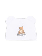 Berretto per neonati Moschino Kids bianco con motivo Teddy bear MMX05HLCA40 10101 MOSCHINO KIDS 