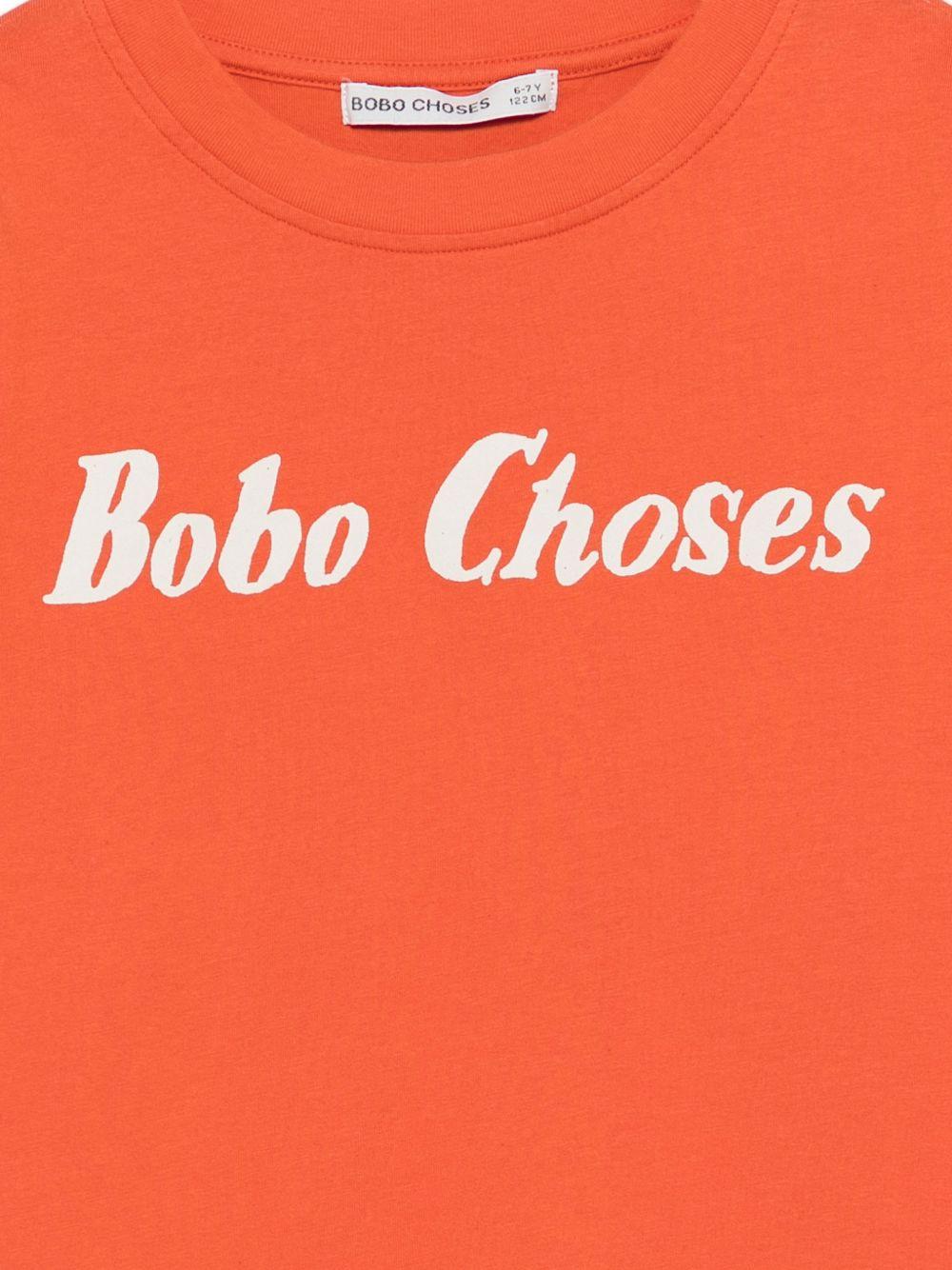 T-shirt per bambino Bobo Choses arancione con scritta logo sul davanti B126AC016 811 BOBO CHOSES KIDS 