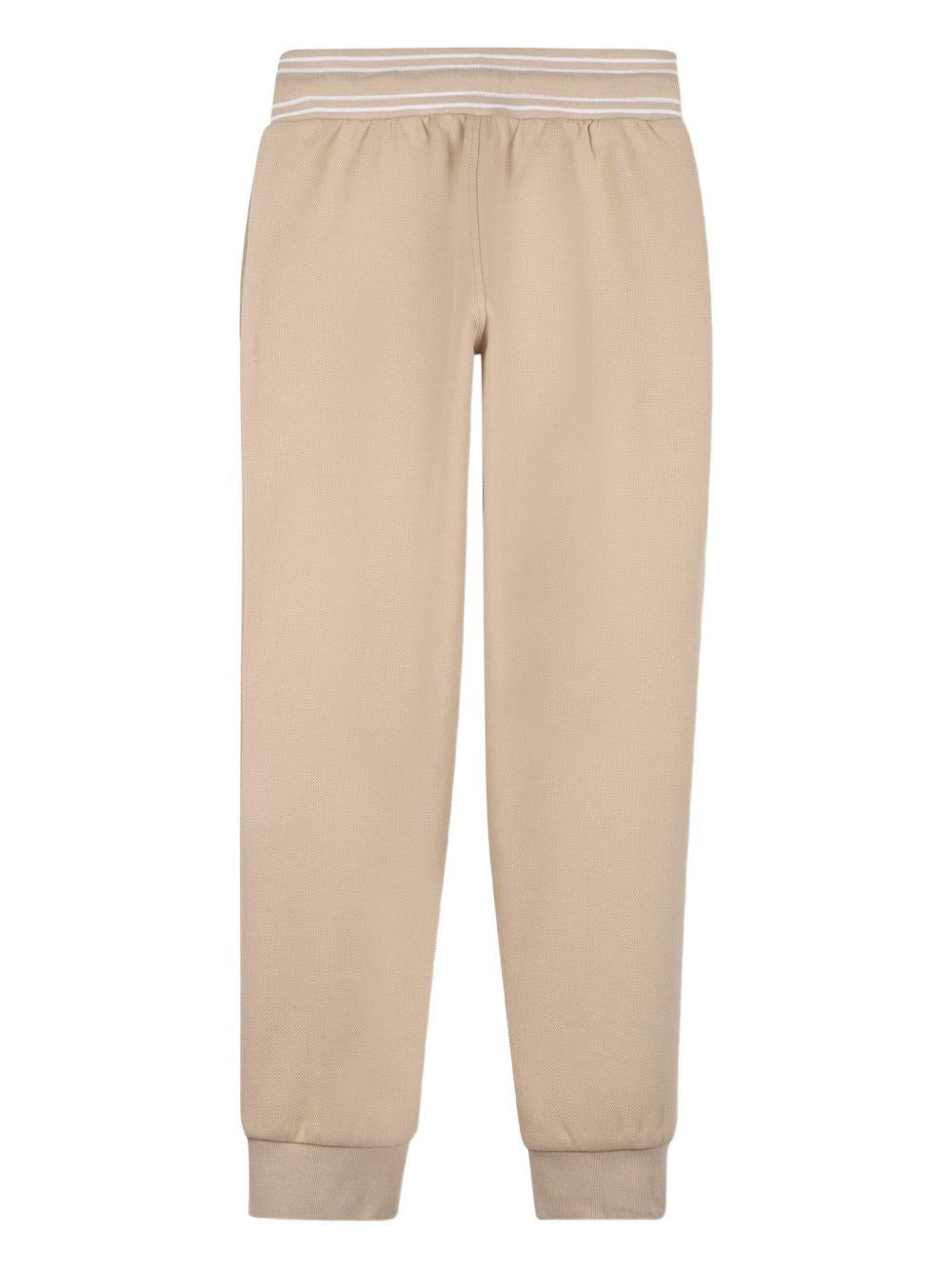 Pantaloni sportivi da bambino Boss Kids beige con stampa logo J52909 249 BOSS KIDS 