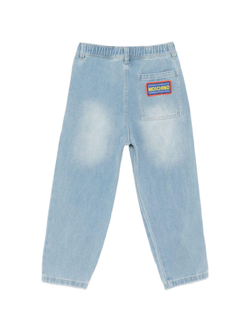 Jeans per bambino Moschino Kids azzurri con decorazioni in rilievo HUP08XL0E37 41100 MOSCHINO KIDS 