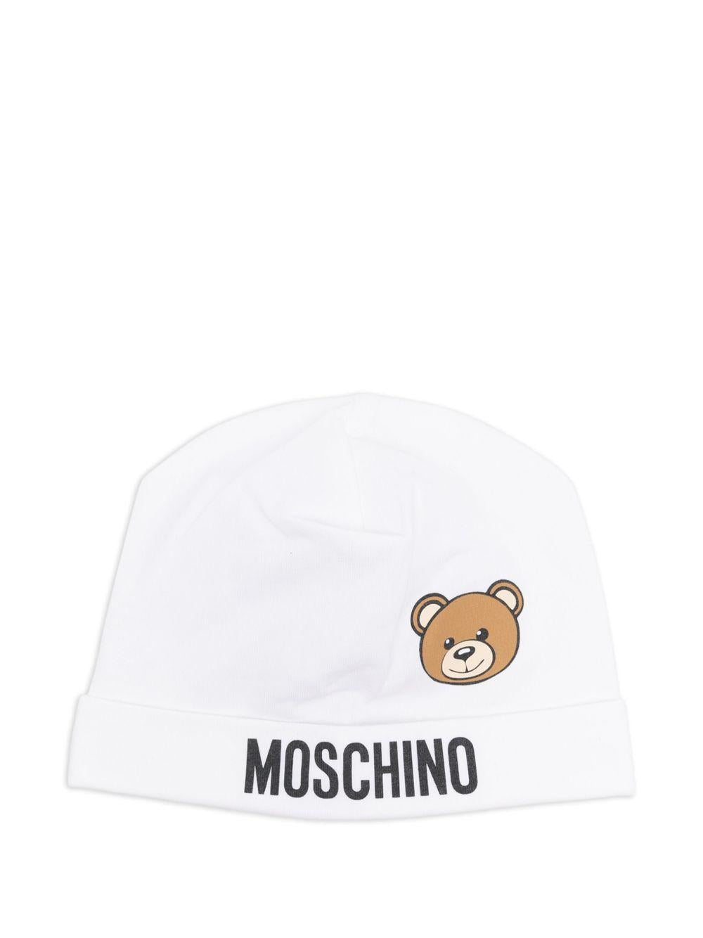 Cappello per neonato Moschino Kids bianco con stampa logo e Teddy Bear MUX05ALBA00 10101 MOSCHINO KIDS 