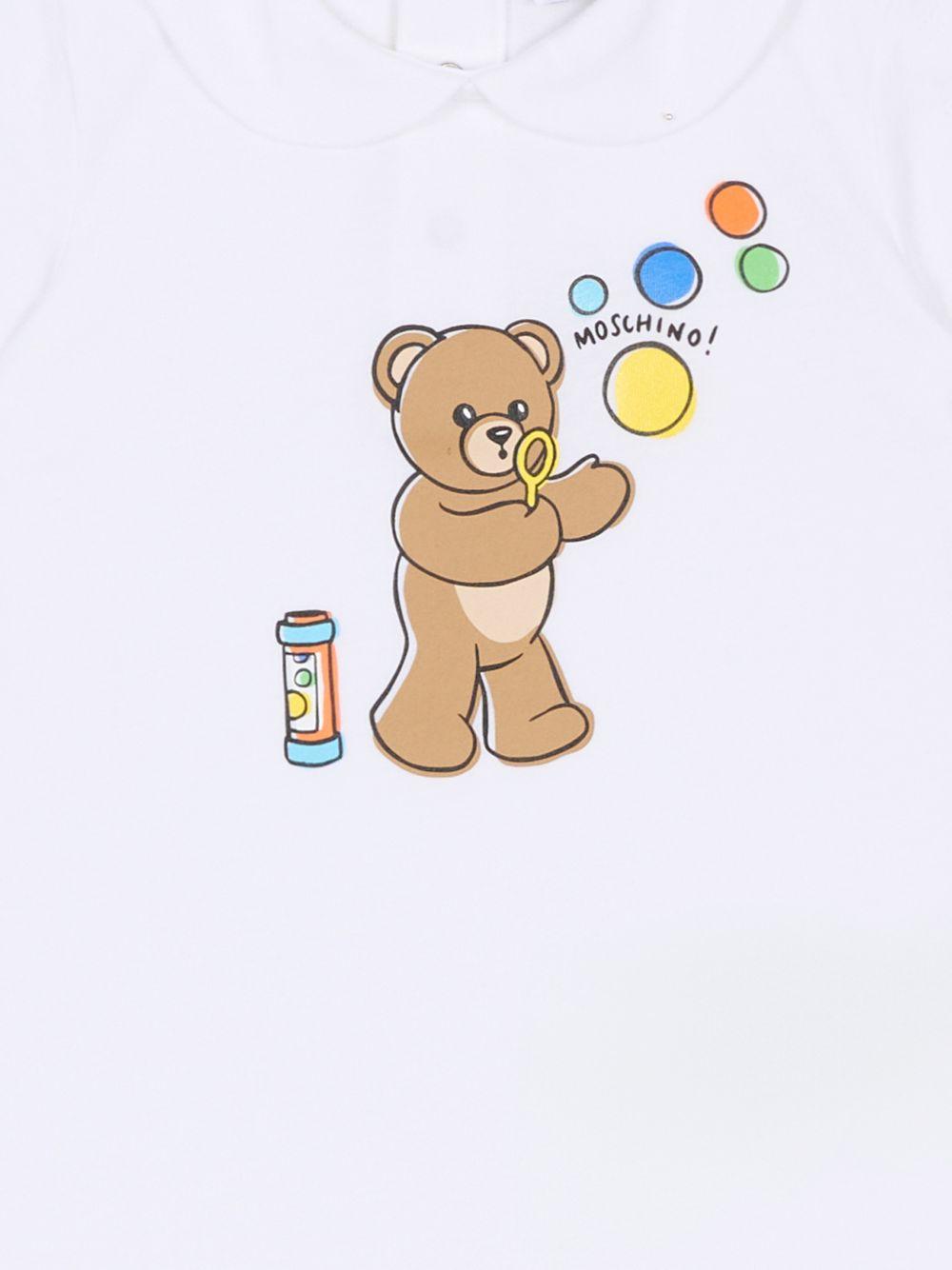 Tutina per neonati Moschino Kids bianca con stampa grafica Orsetto con bolle di sapone MUT04MLAA03 10101 MOSCHINO KIDS 