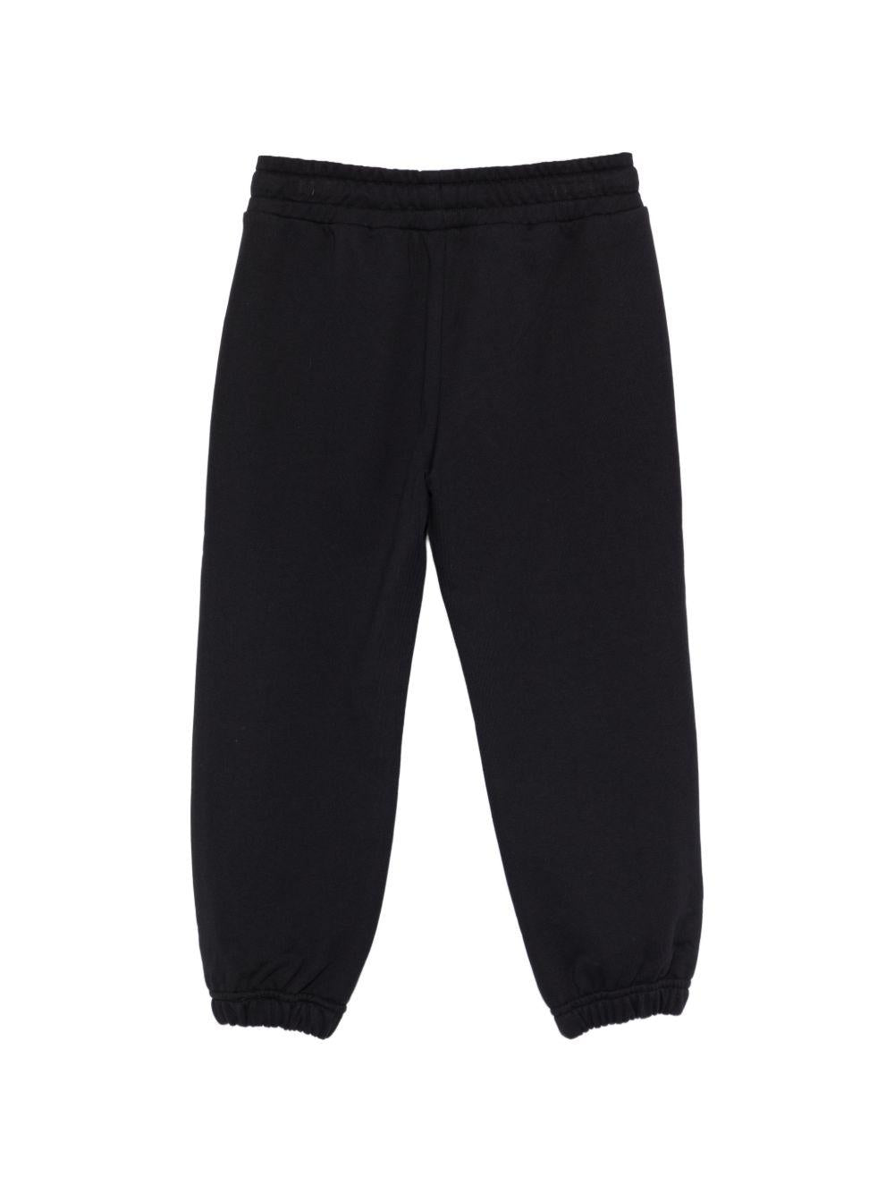 Pantaloni sportivi per bambino Moschino Kids neri con logo sul davanti HMP07CLCA32 60100 MOSCHINO KIDS 