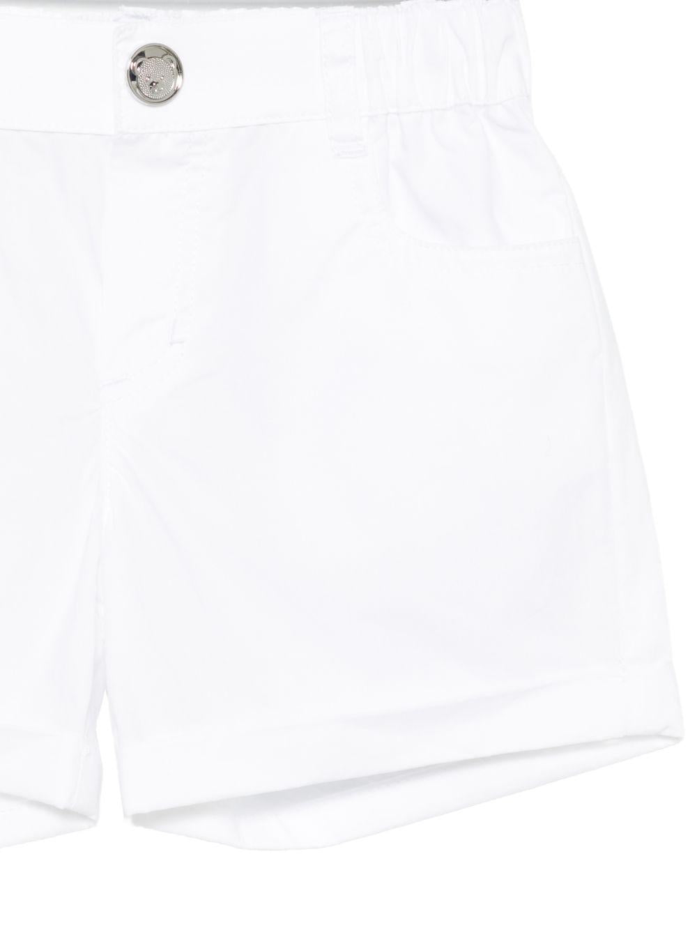 Shorts per neonato Moschino Kids bianchi con logo sul retro MNQ00RLLA10 10101 MOSCHINO KIDS 