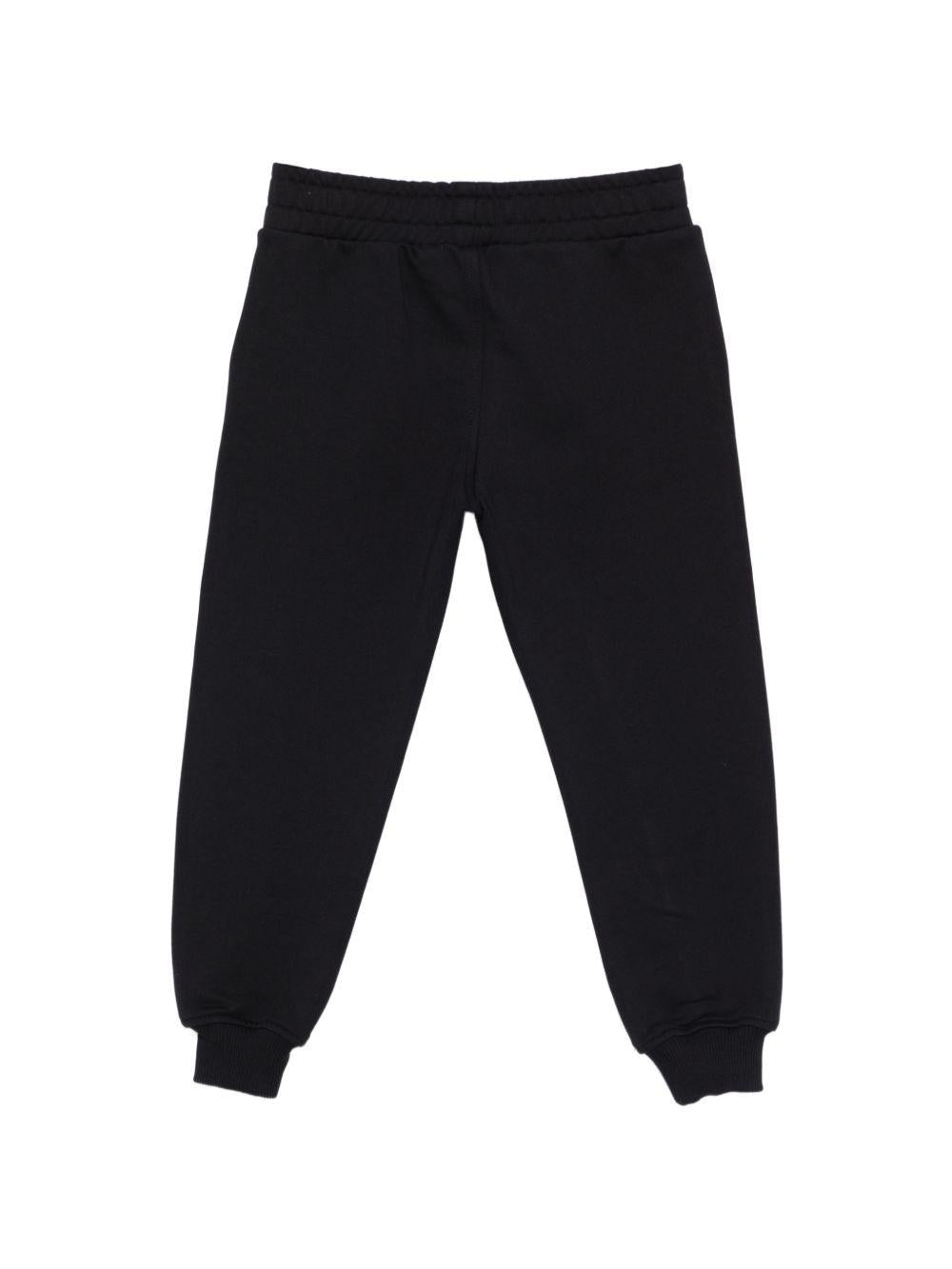 Pantaloni per bambino Moschino Kids nero con caviglie a coste HUP08YLCA32 60100 MOSCHINO KIDS 