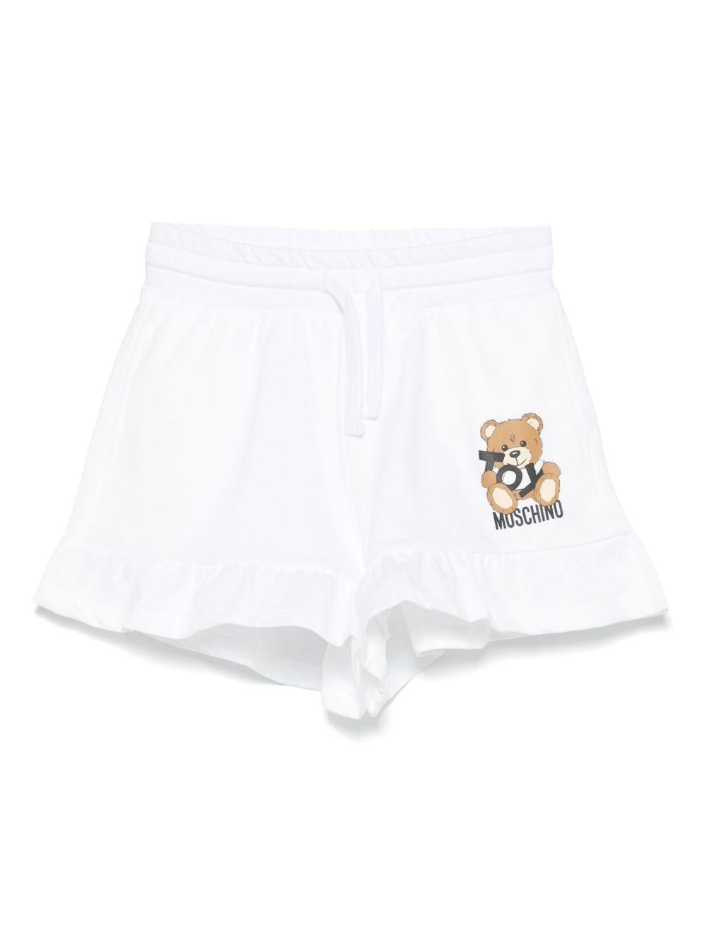 Shorts con stampa Leo Teddy per bambina Moschino Kids bianco con due tasche laterali HAQ014LCA19 10101 MOSCHINO KIDS 