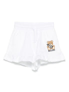 Shorts con stampa Leo Teddy per bambina Moschino Kids bianco con due tasche laterali HAQ014LCA19 10101 MOSCHINO KIDS 