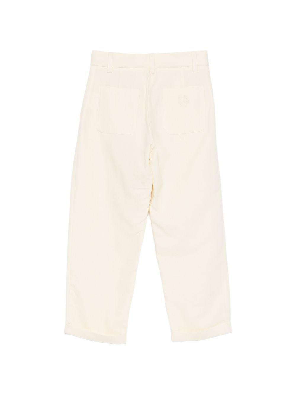 Pantaloni per bambino Emporio Armani Kids beige con dettagli plissettati EB000903 AF21040 U1079 EMPORIO ARMANI KIDS 