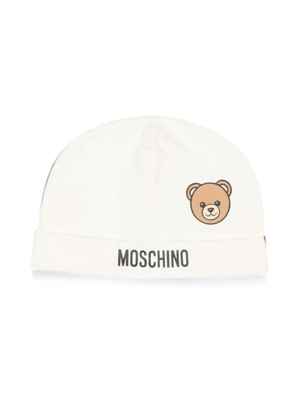 Berretto per neonati Moschino Kids bianco con dettaglio Teddy Bear MUX066LCA40 10063 MOSCHINO KIDS 