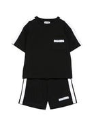 Completo per bambino Moschino Kids nero con dettagli a contrasto HUG00XLAA51 60100 MOSCHINO KIDS 