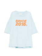 T-shirt per bambino Palm Angels Kids azzurra con stampa grafica sul retro PBAA002S26JER002 960 PALM ANGELS KIDS 
