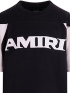 T-shirt per bambino Amiri Kids nero con logo sul davanti ACTOJR1002 001 AMIRI KIDS 