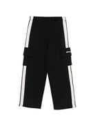 Pantaloni sportivi per bambina Palm Angels Kids neri con decorazioni sui lati PGCJ011S26FLE001 110 PALM ANGELS KIDS 